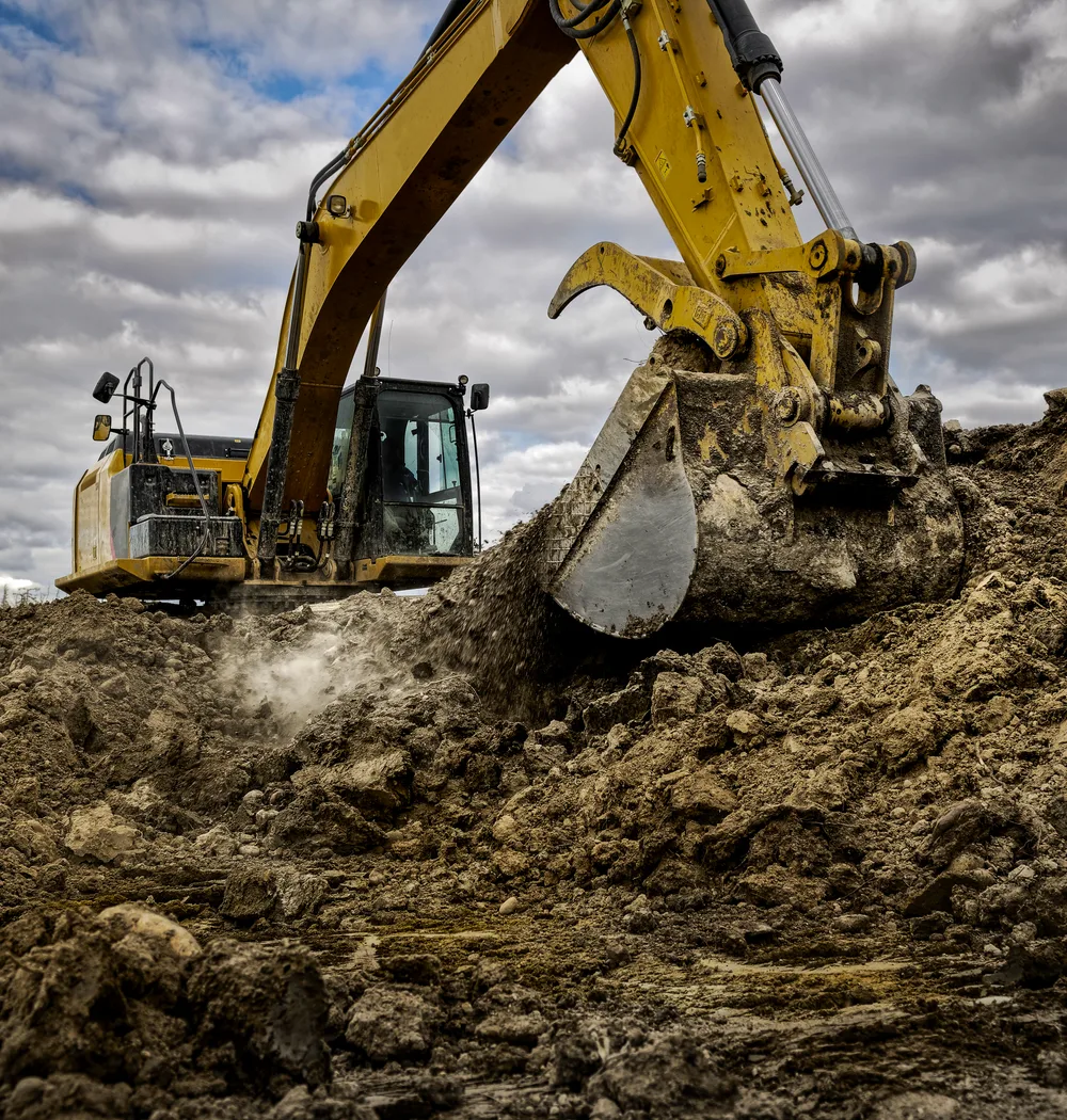 Excavator digging on a work site